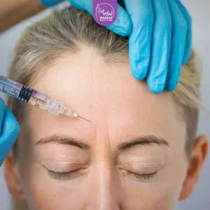 doctor injecting botox to forehead