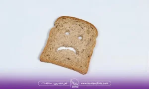 عکس یک نان تست که روی آن یک صورت ناراحت کشیده شده است